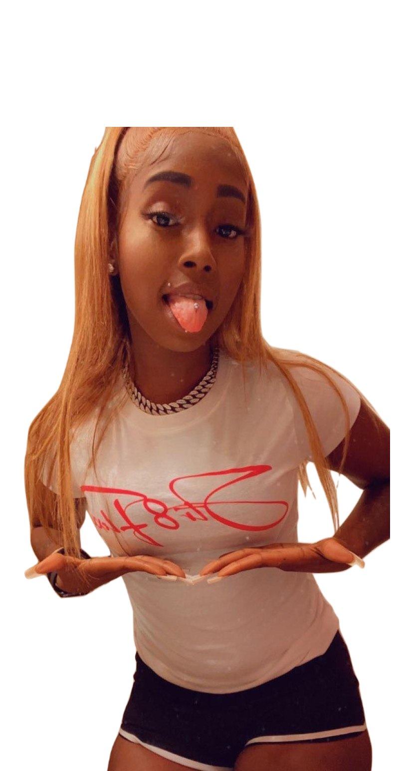 A woman in a white shirt and black shorts is sticking her tongue out.
