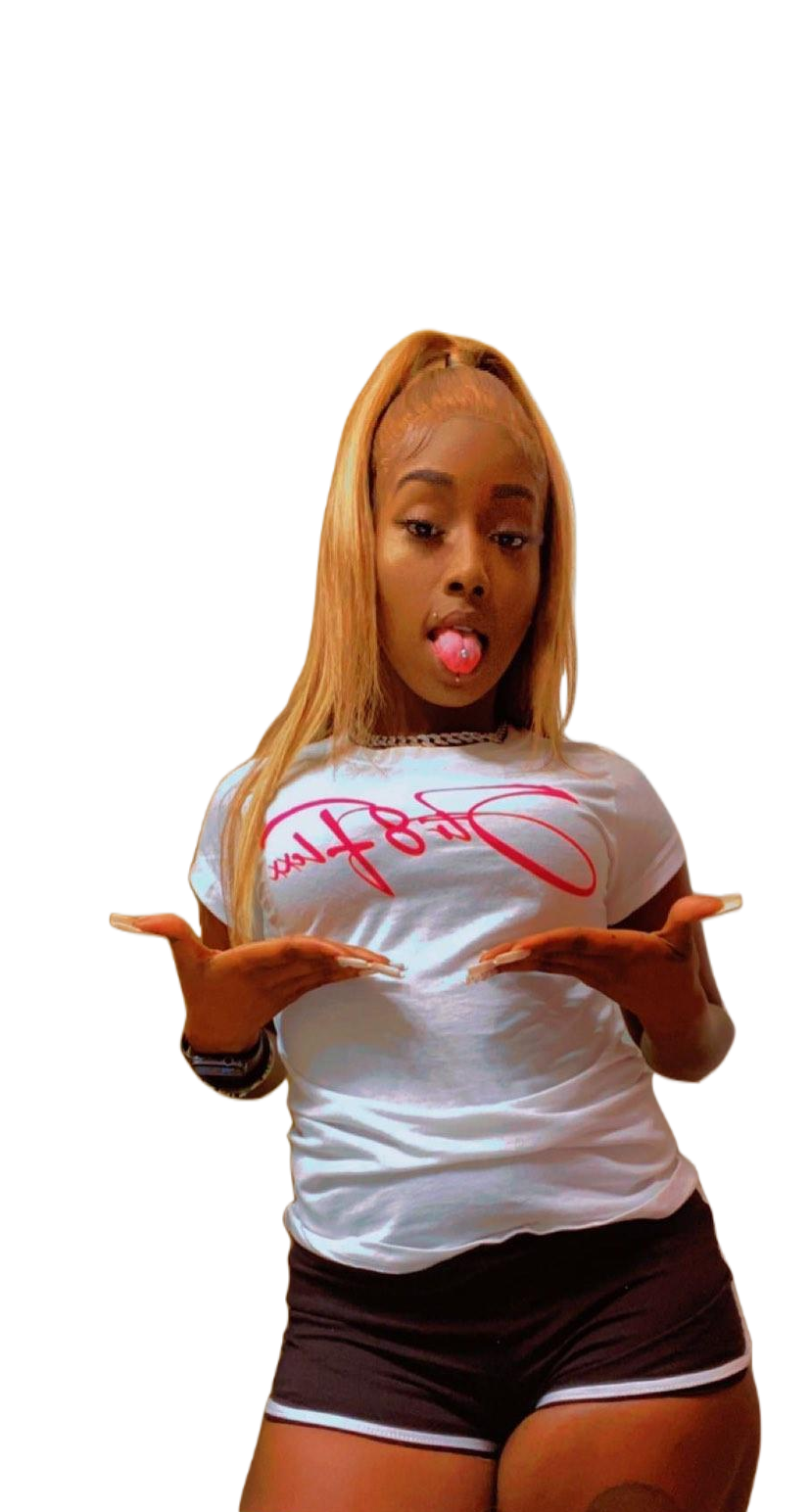 A woman in a white shirt and black shorts is sticking her tongue out.