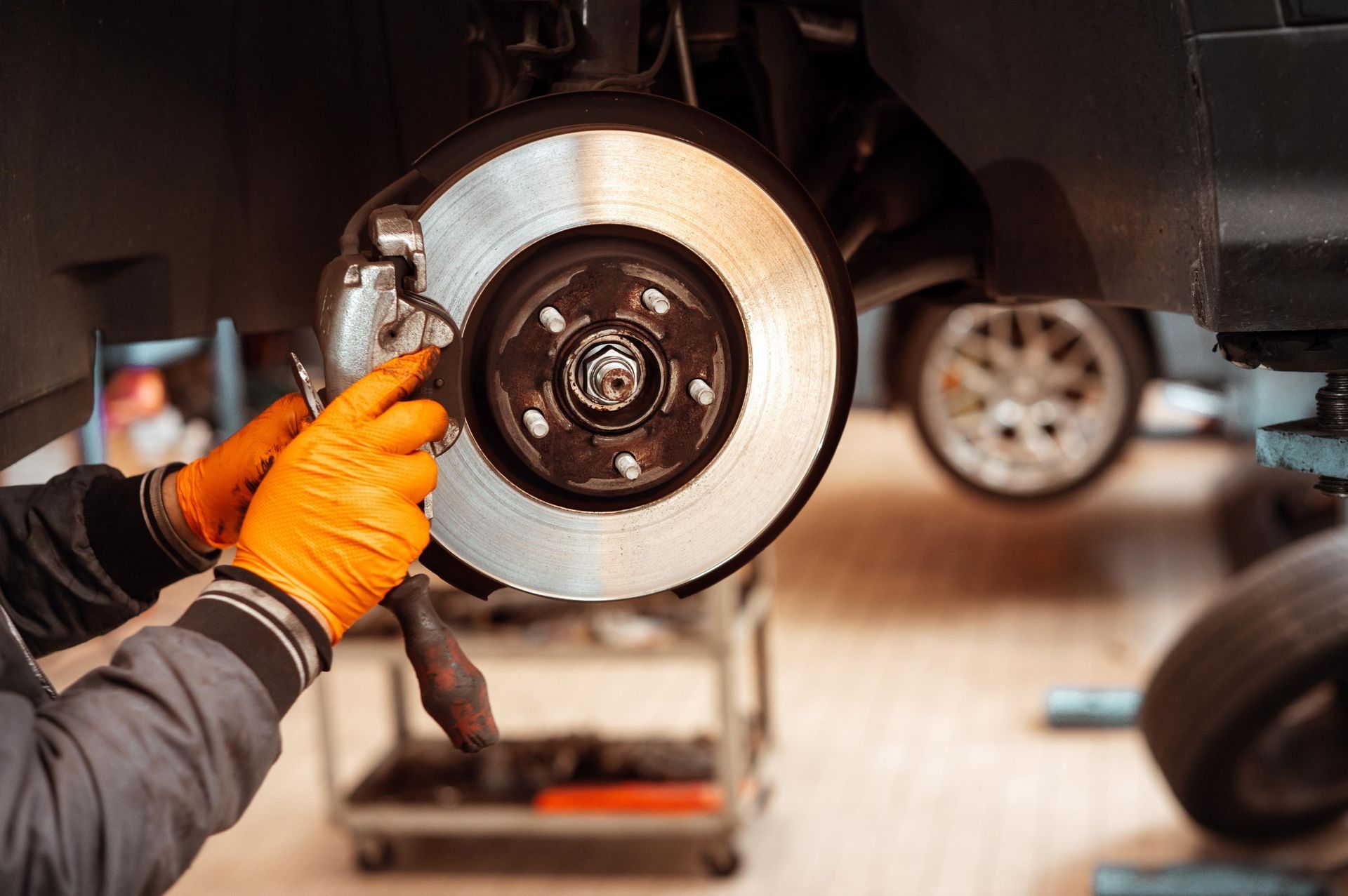 A person is pouring oil into a car engine.