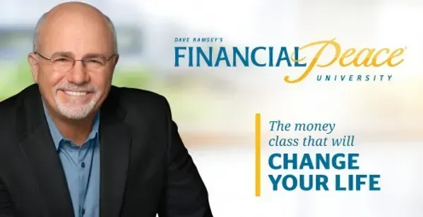 A man is sitting in front of an ad for financial peace university