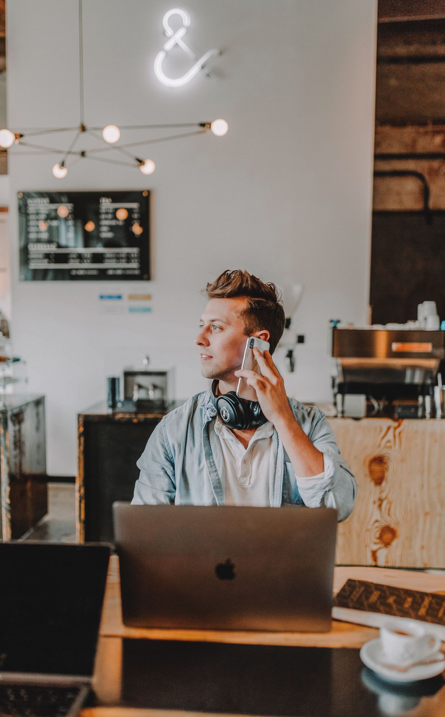 man on phone and laptop