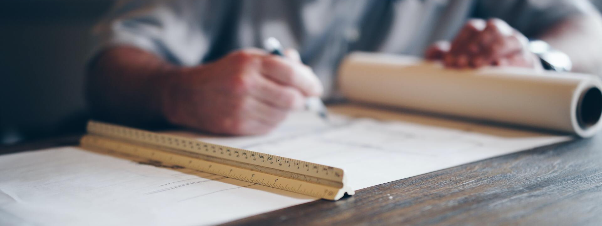 man making blueprint