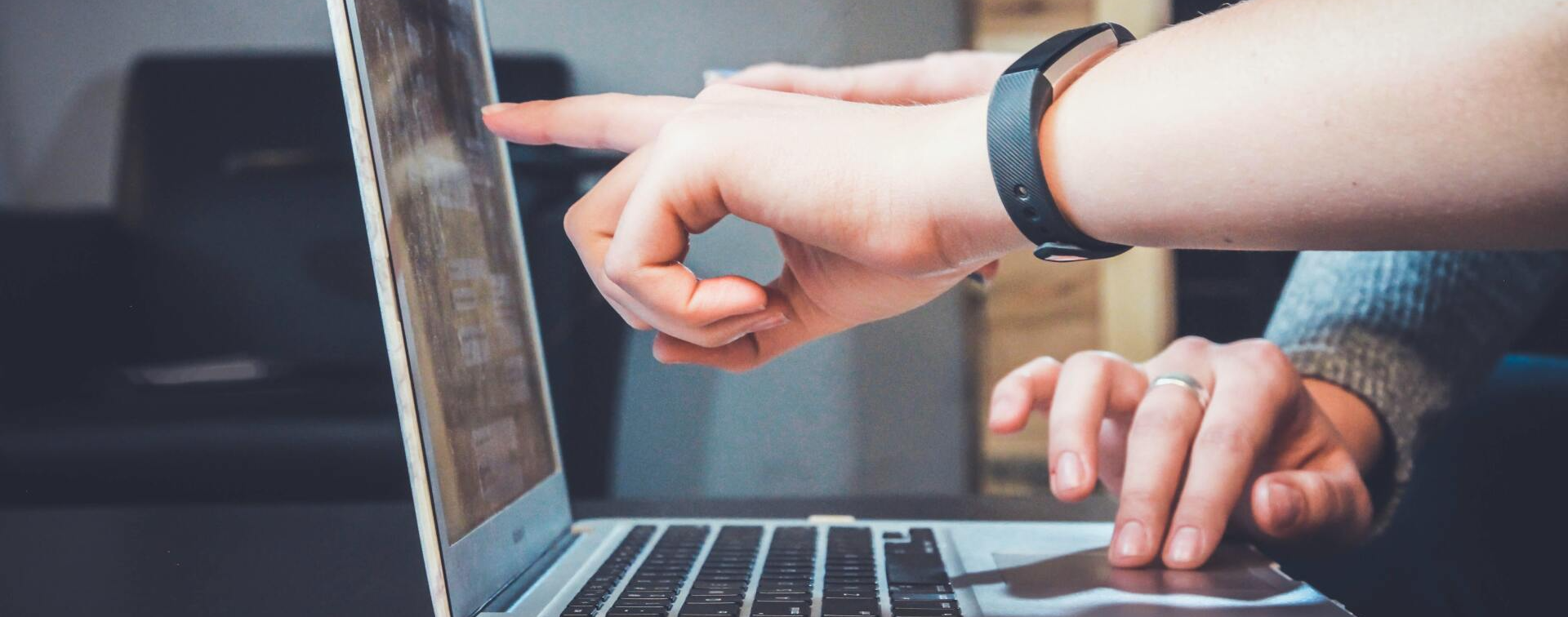 two people on laptop