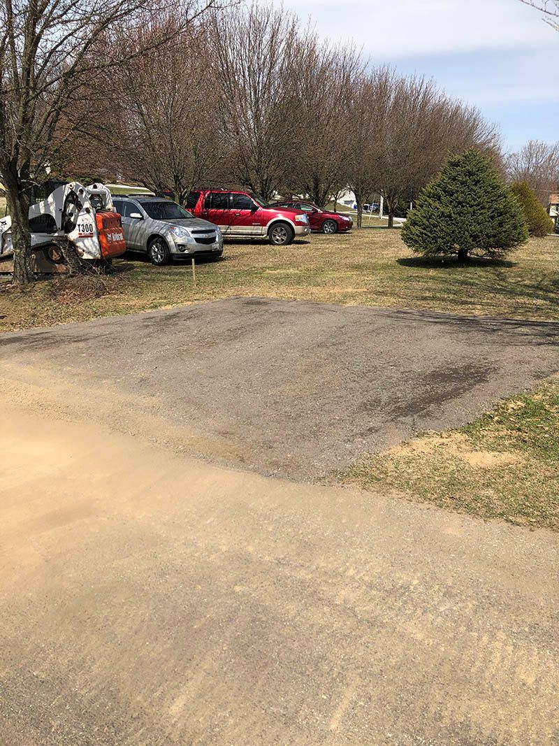 A lot of cars are parked in a parking lot.