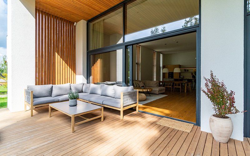 Wooden Deck And Sofa — Dracut, MA — Down to Earth Construction Wooden Deck And Sofa — Dracut, MA — Down to Earth Construction