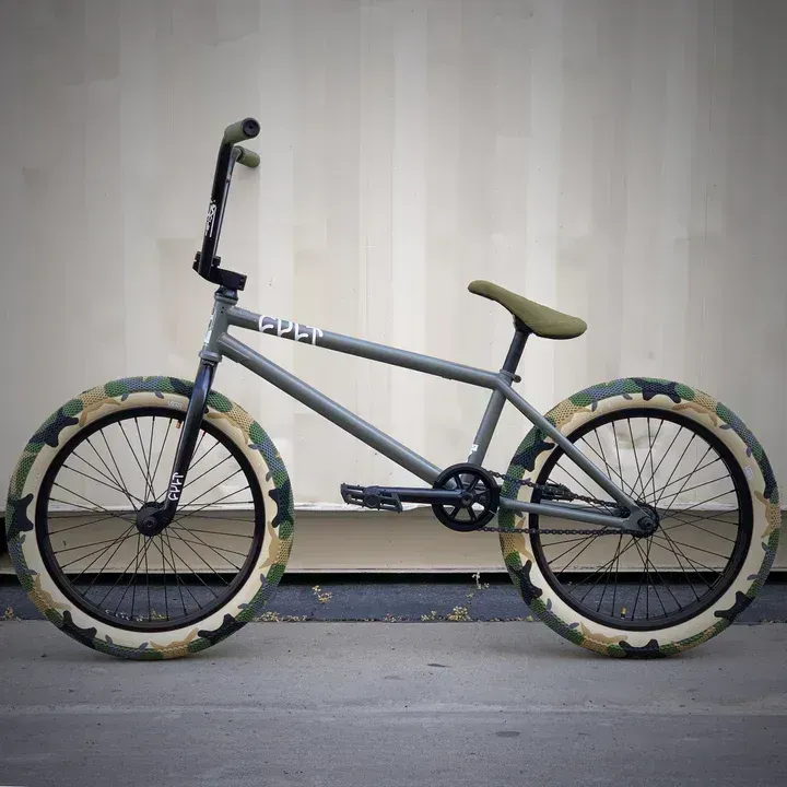 A bicycle with the word open on the front
