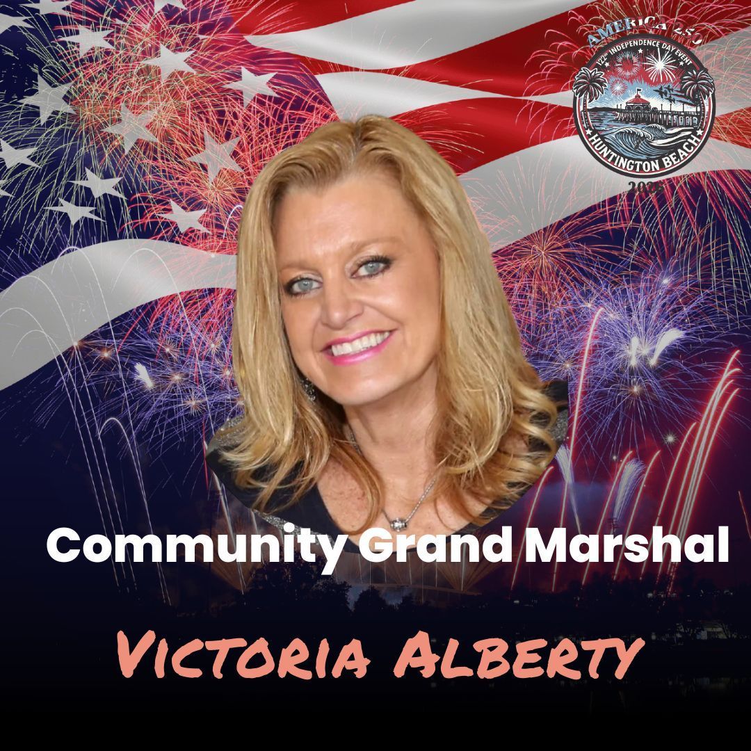 Victoria Alberty Community Grand Marshal Victoria Alberty smiling in front of fireworks and an American flag backdrop