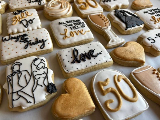 Decorated cookies with gold and black icing celebrating a 50th wedding anniversary. Base Camp Bakery Gunnison, Colorado https://share.google/AgqUzUKNzsb0ThlP5, https://www.facebook.com/BaseCampBakery1, https://www.instagram.com/basecampbakery_81230