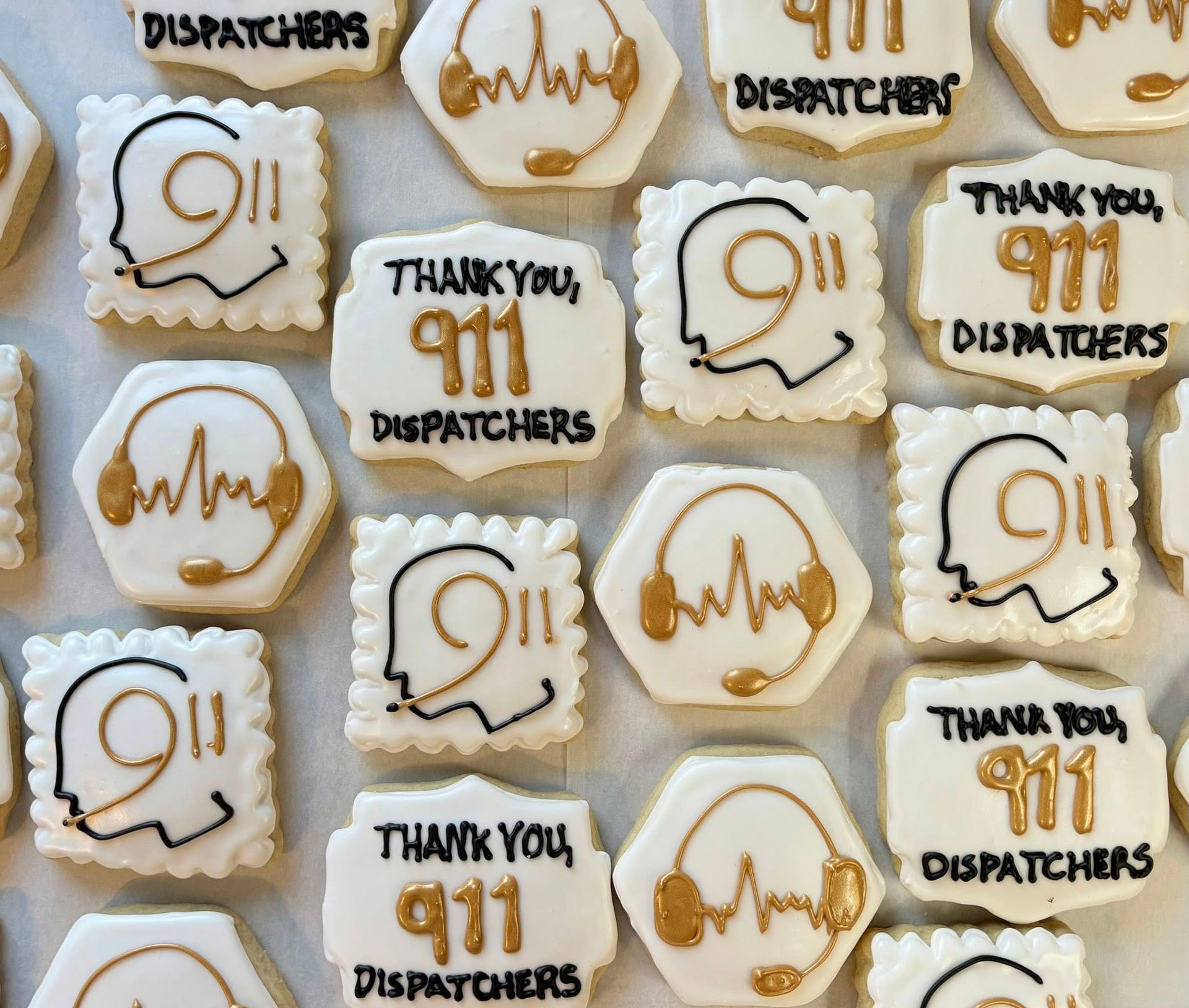 Cookies decorated with “Thank you, 911 Dispatchers” and 911 symbols with a headset. Base Camp Bakery Gunnison, Colorado https://share.google/AgqUzUKNzsb0ThlP5, https://www.facebook.com/BaseCampBakery1, https://www.instagram.com/basecampbakery_81230