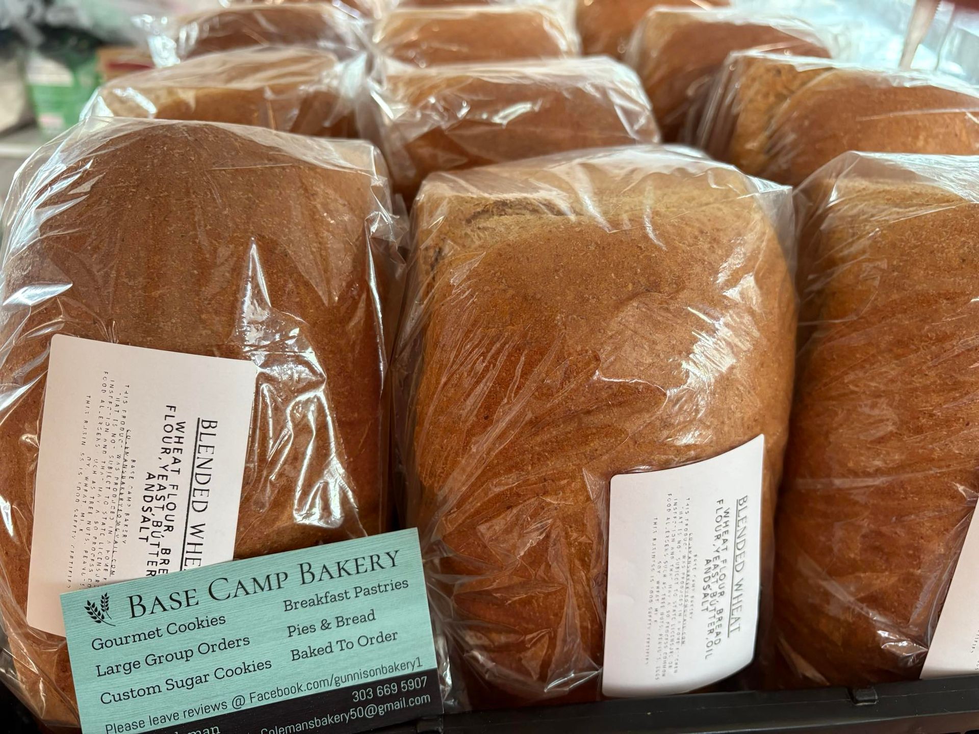 Loaves of bread wrapped in plastic. Base Camp Bakery Gunnison, Colorado https://share.google/AgqUzUKNzsb0ThlP5, https://www.facebook.com/BaseCampBakery1, https://www.instagram.com/basecampbakery_81230