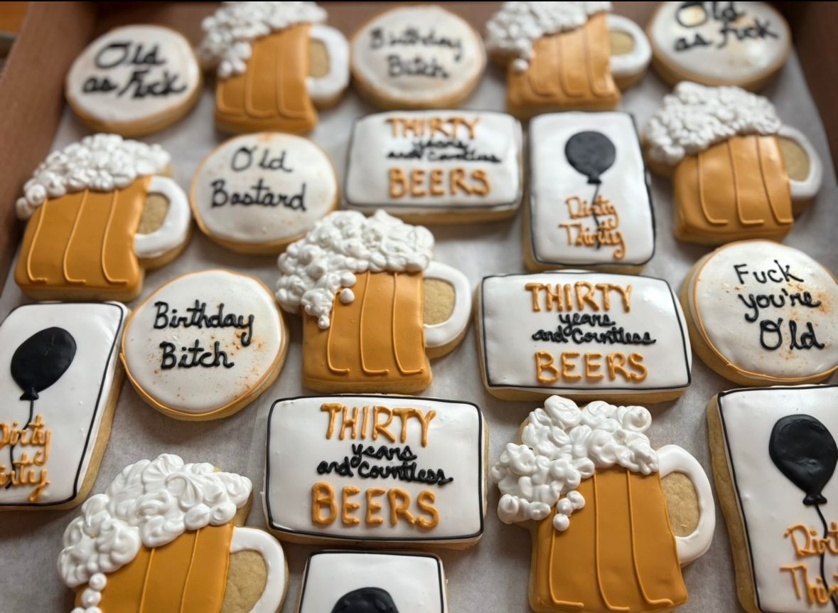 Box of decorated sugar cookies, beer mugs, and birthday greetings. Base Camp Bakery Gunnison, Colorado https://share.google/AgqUzUKNzsb0ThlP5, https://www.facebook.com/BaseCampBakery1, https://www.instagram.com/basecampbakery_81230