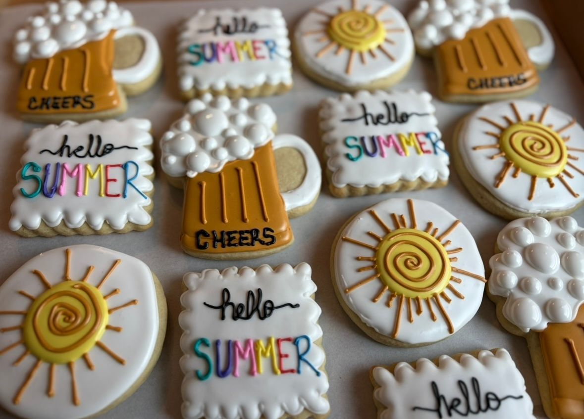Summer-themed sugar cookies: beer mugs, suns. Base Camp Bakery Gunnison, Colorado https://share.google/AgqUzUKNzsb0ThlP5, https://www.facebook.com/BaseCampBakery1, https://www.instagram.com/basecampbakery_81230
