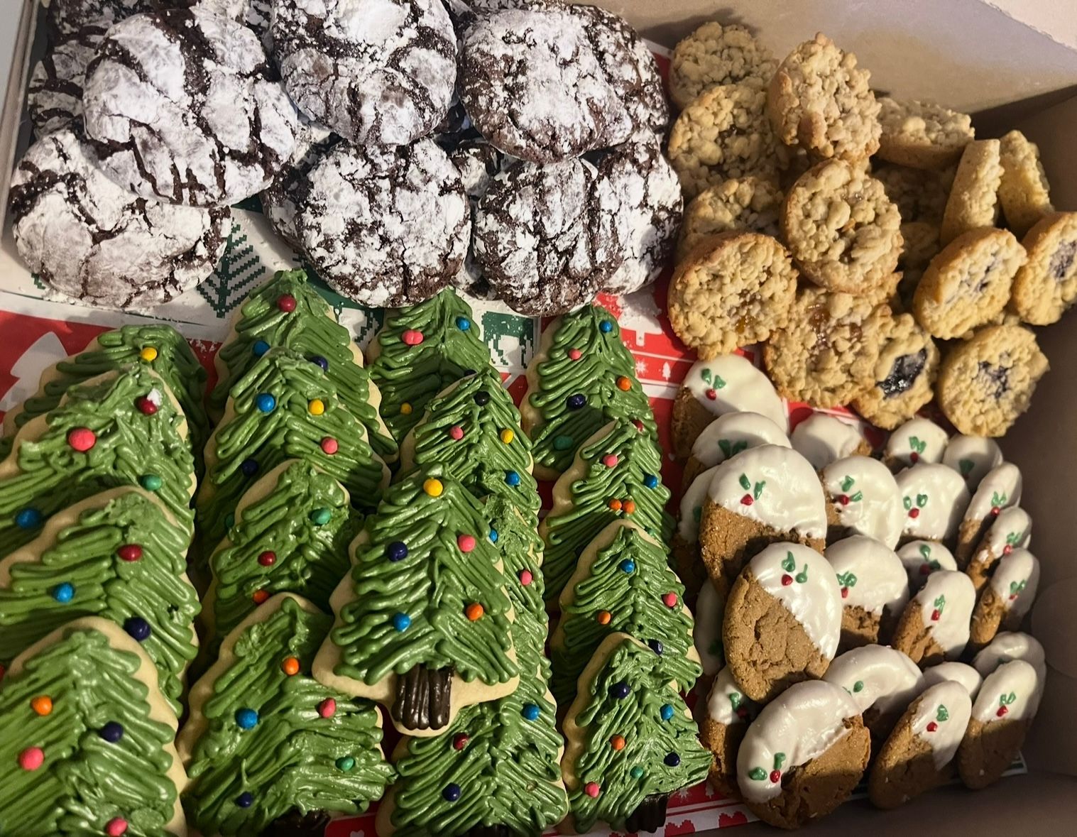 Cookie assortment box: chocolate crinkles, oatmeal, tree-shaped, and dipped cookies. Base Camp Bakery Gunnison, Colorado https://share.google/AgqUzUKNzsb0ThlP5, https://www.facebook.com/BaseCampBakery1, https://www.instagram.com/basecampbakery_81230