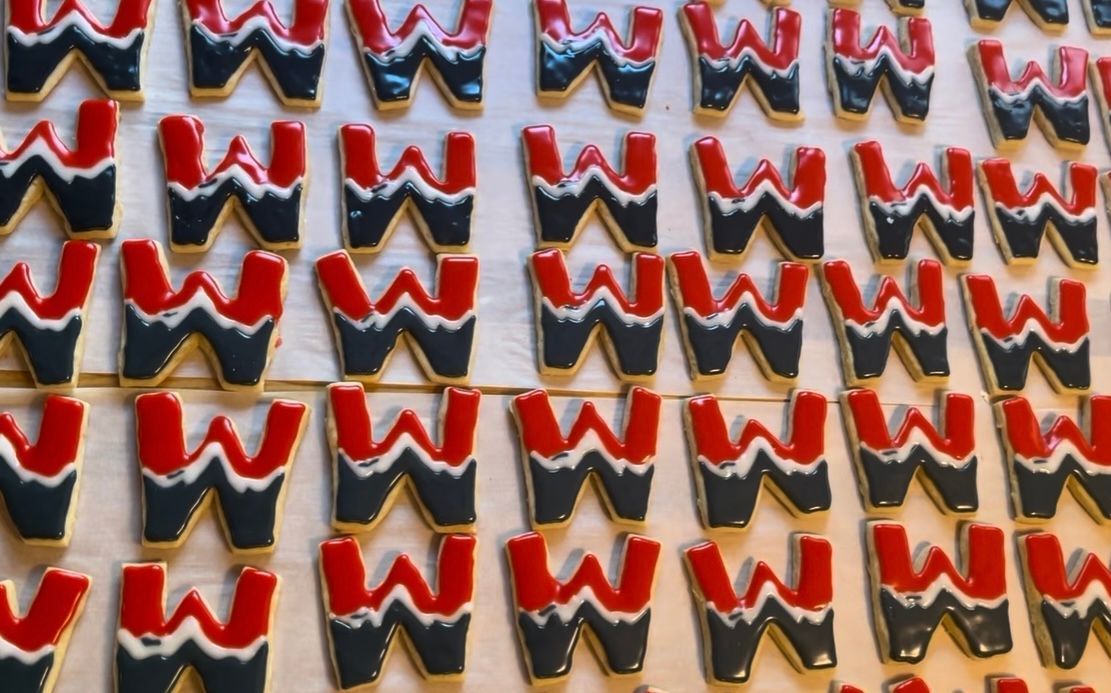 Rows of red, black, and white glazed. Base Camp Bakery Gunnison, Colorado https://share.google/AgqUzUKNzsb0ThlP5, https://www.facebook.com/BaseCampBakery1, https://www.instagram.com/basecampbakery_81230