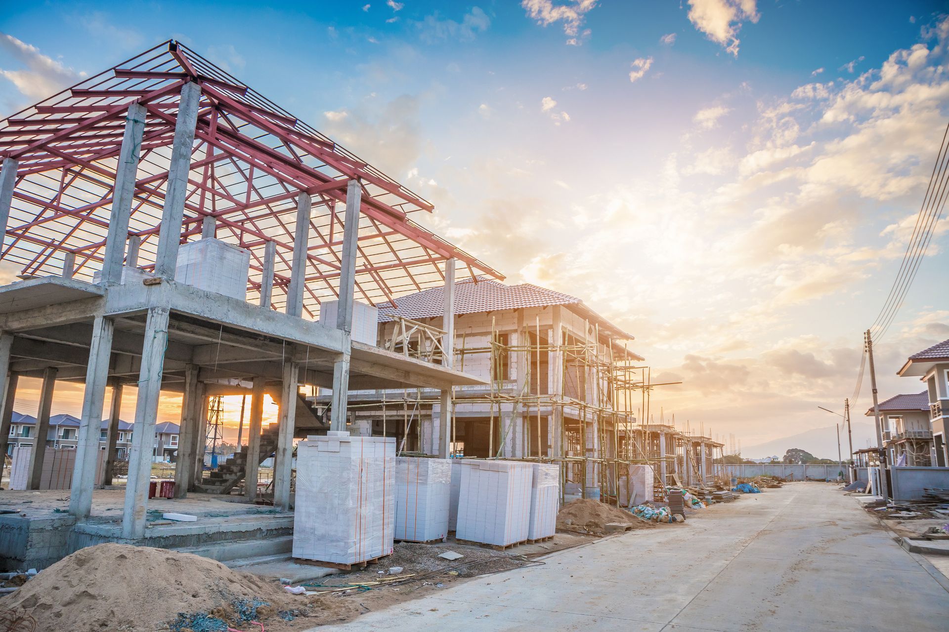 New house under construction at sunset, featuring building supplies from MaCon Supply, Inc.