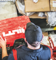 Worker using Hilti tools