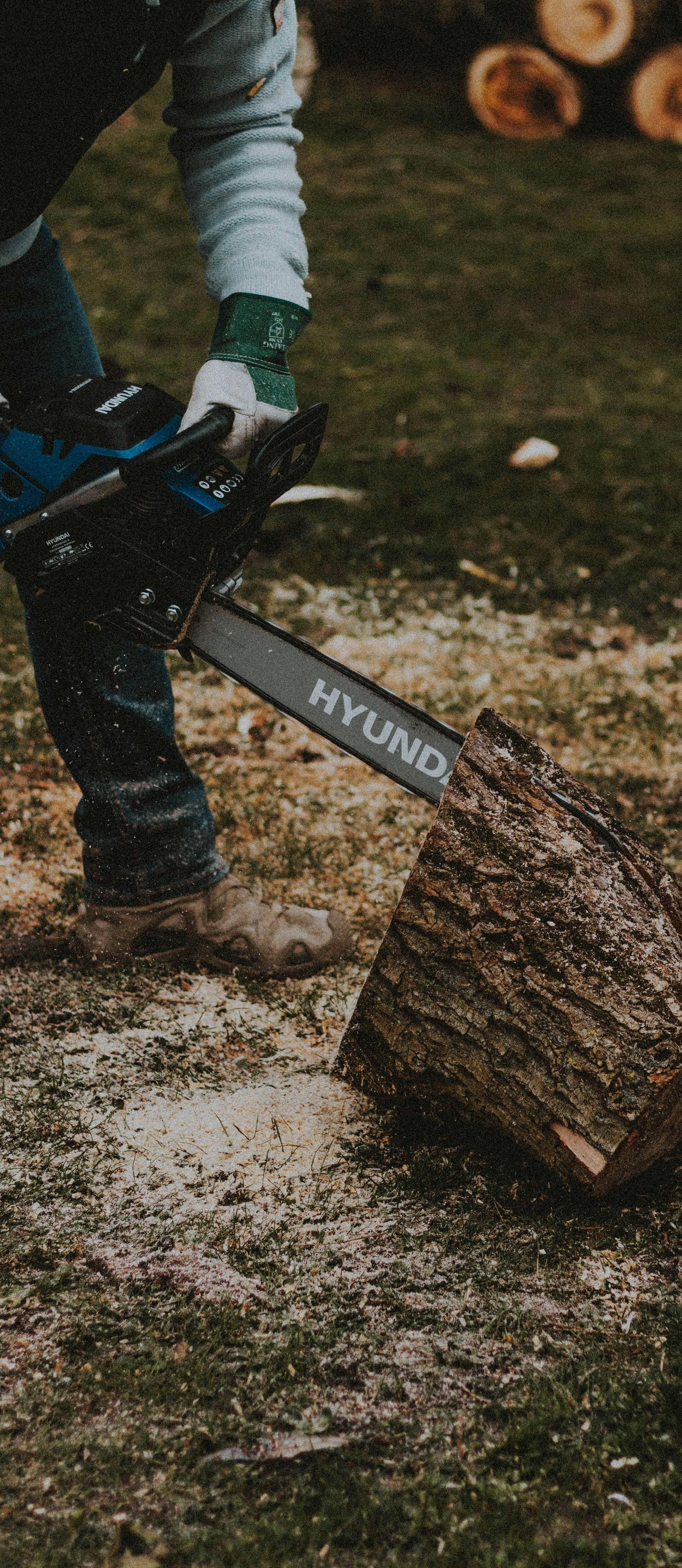 person using a chainsaw
