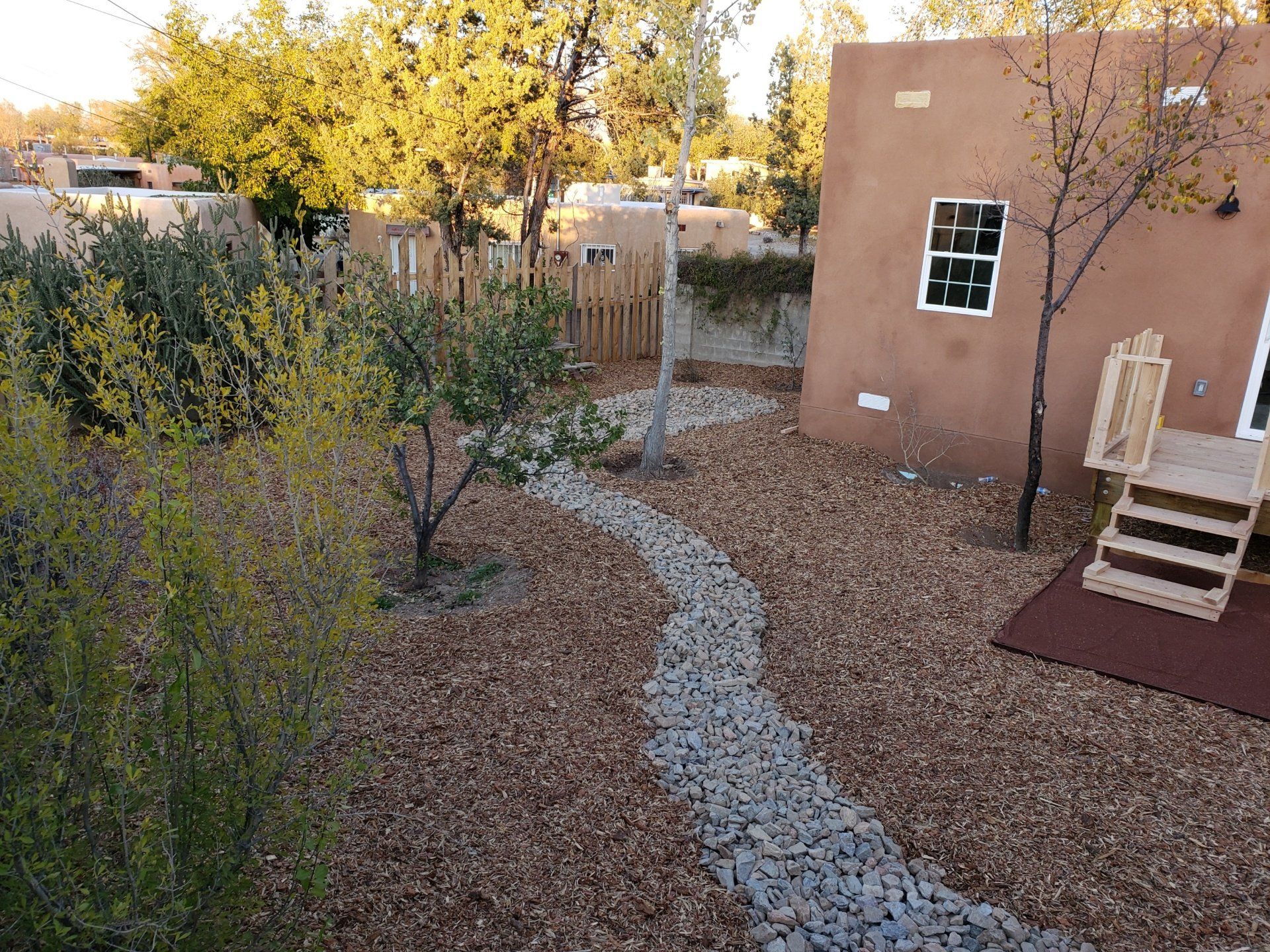 An aerial view of a house with a path leading to it
