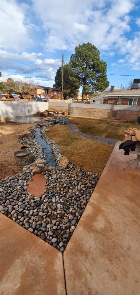 There is a stream running through the middle of the yard.