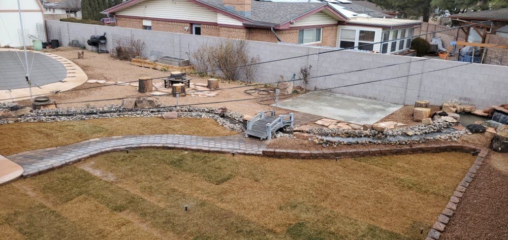 An aerial view of a backyard with a fence and a pool.