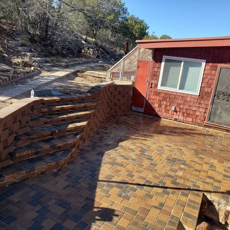A brick house with stairs leading up to it