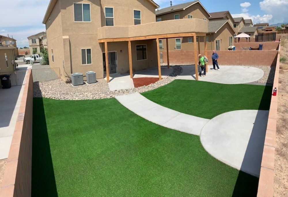 A large house with a large lawn in front of it