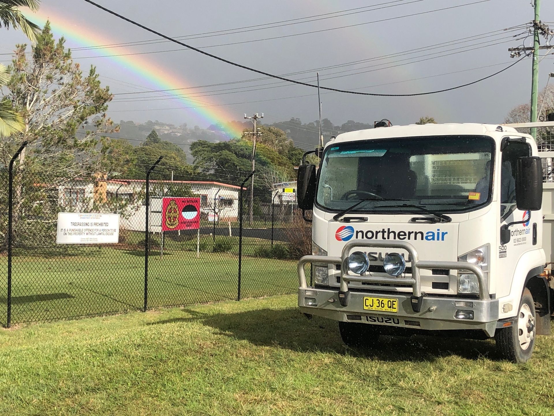 A Northernair vehicle with a rainbow behind it — Northernair in East Lismore, NSW
