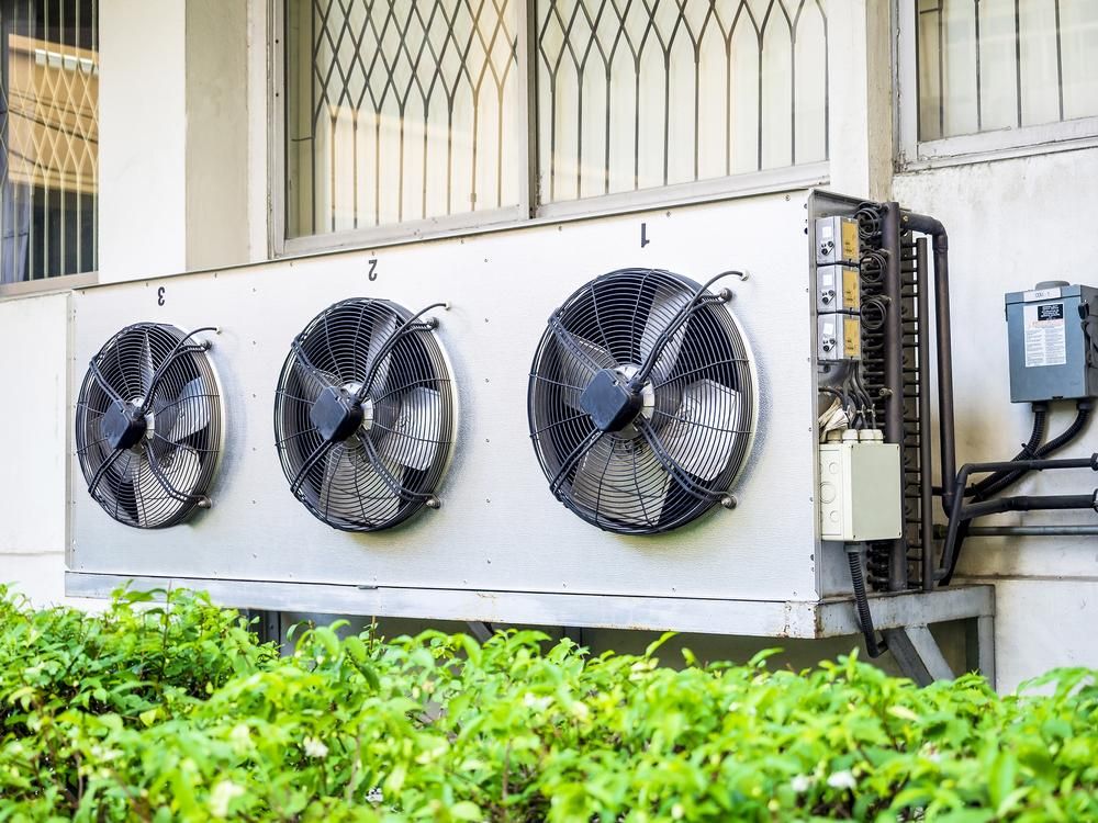 There Are Three Fans on The Side of A Building — Northernair in Kyogle, NSW