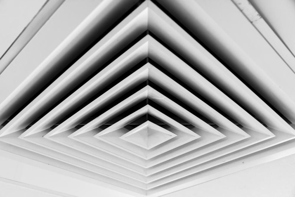 A Black and White Photo of A Square Air Vent on A Ceiling — Northernair in Lismore, NSW