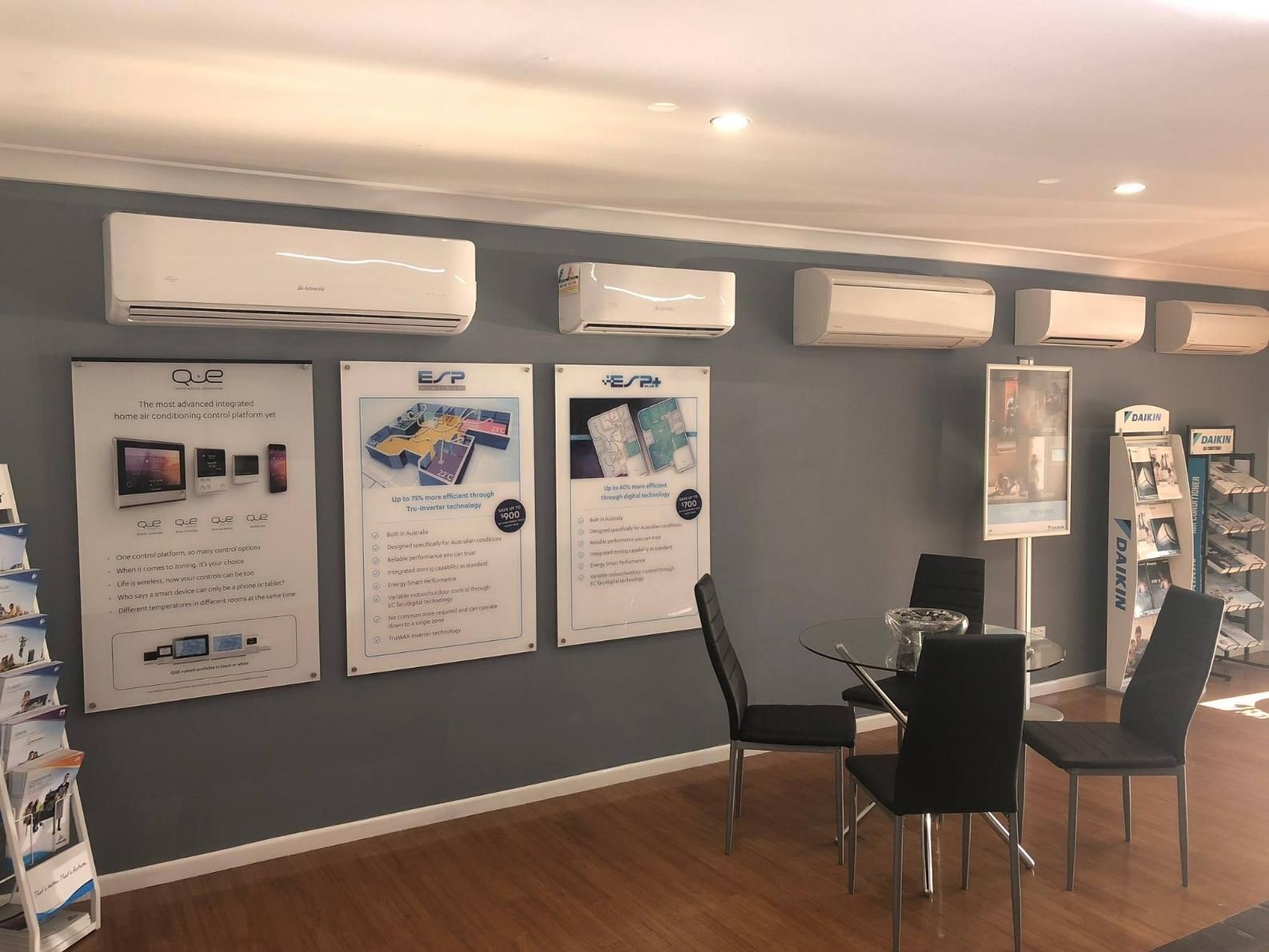 A Room with A Table and Chairs and A Lot of Air Conditioners on The Wall — Northernair in Lennox Head, NSW