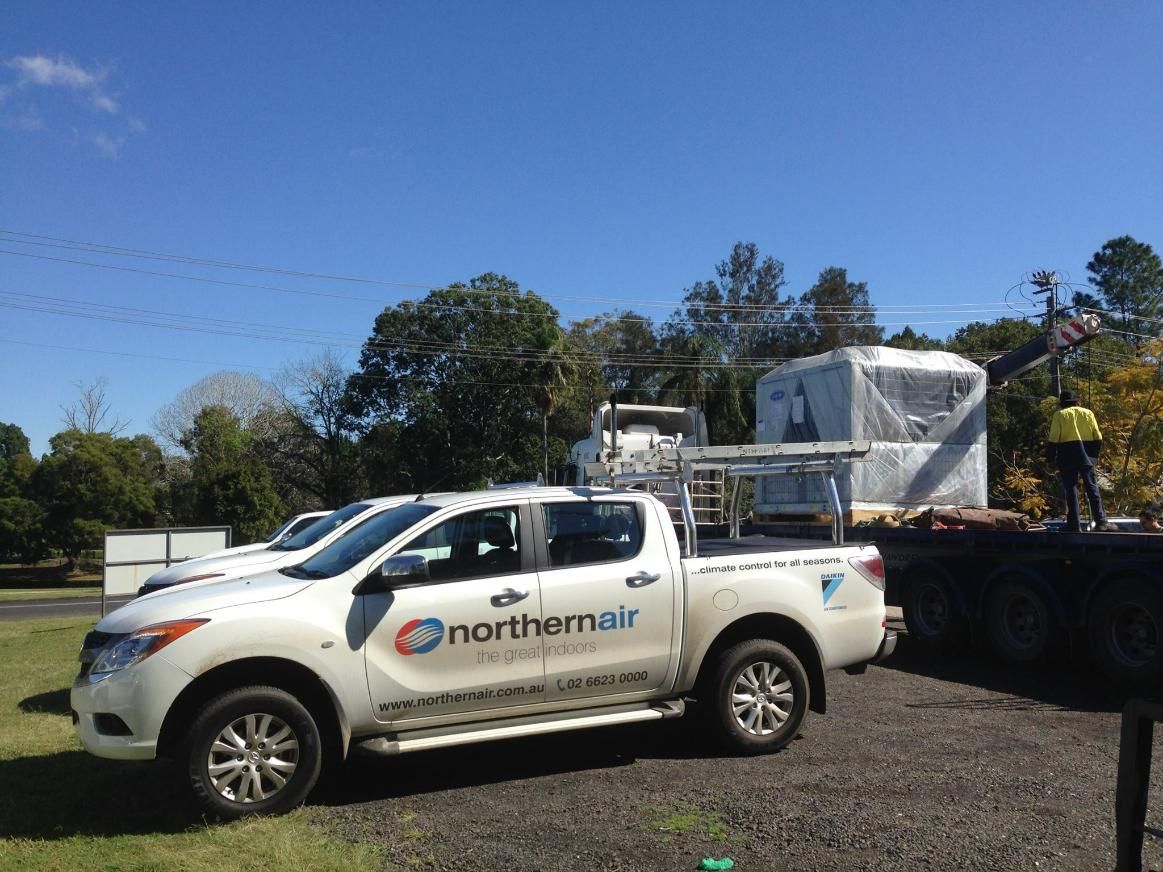 A White Truck with Northern Air Written on The Side Is Parked in A Gravel Lot — Northernair in Casino, NSW