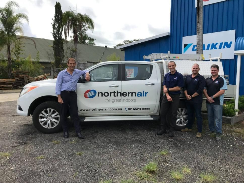 A Group of Men Are Standing Next to A Truck that Says Northernair — Northernair in East Lismore, NSW