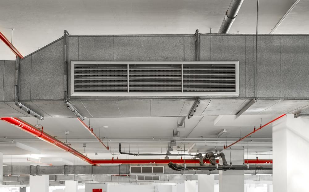 A Large Air Duct Is Hanging from The Ceiling of A Building — Northernair in Lismore, NSW