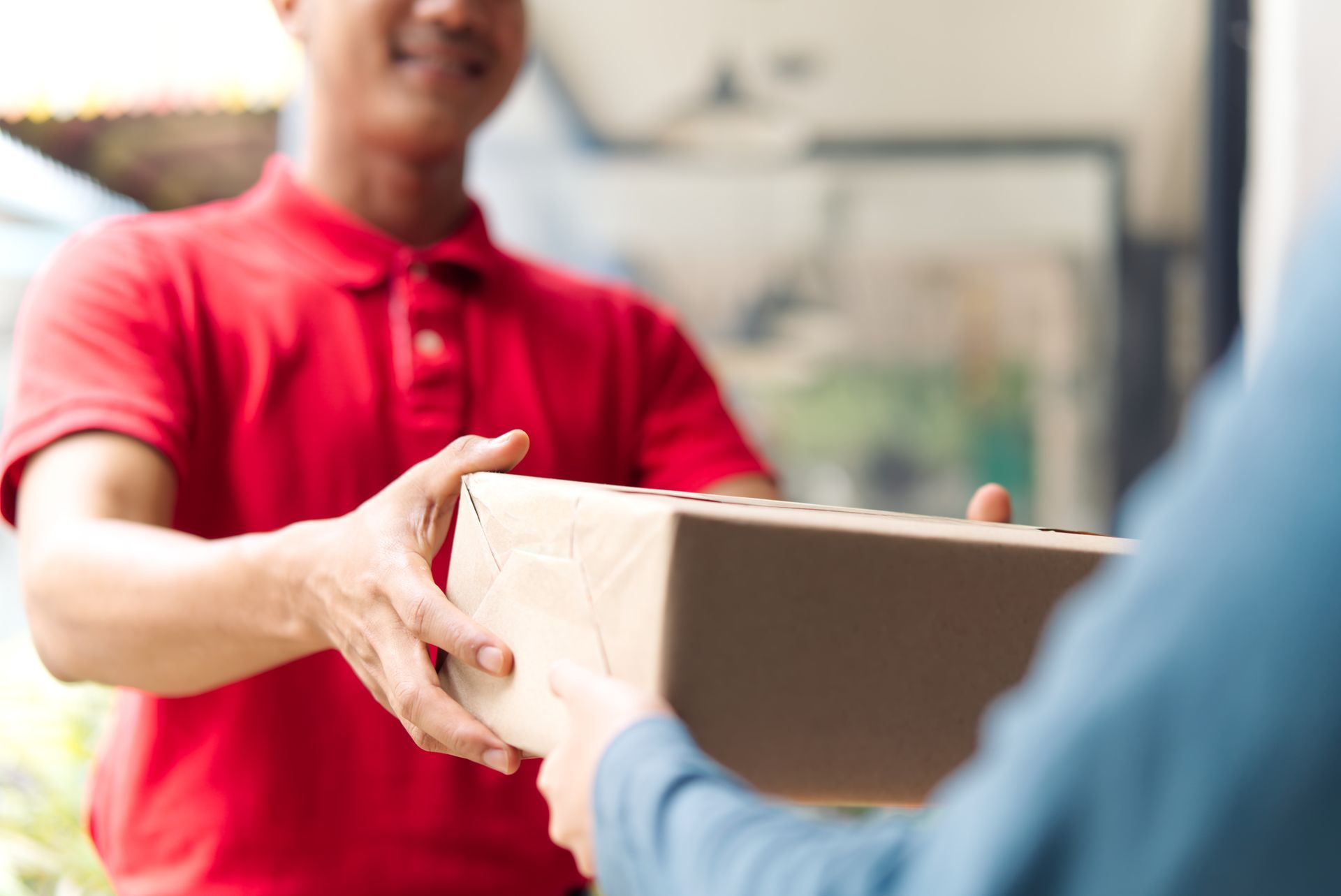 Delivery man handing a parcel