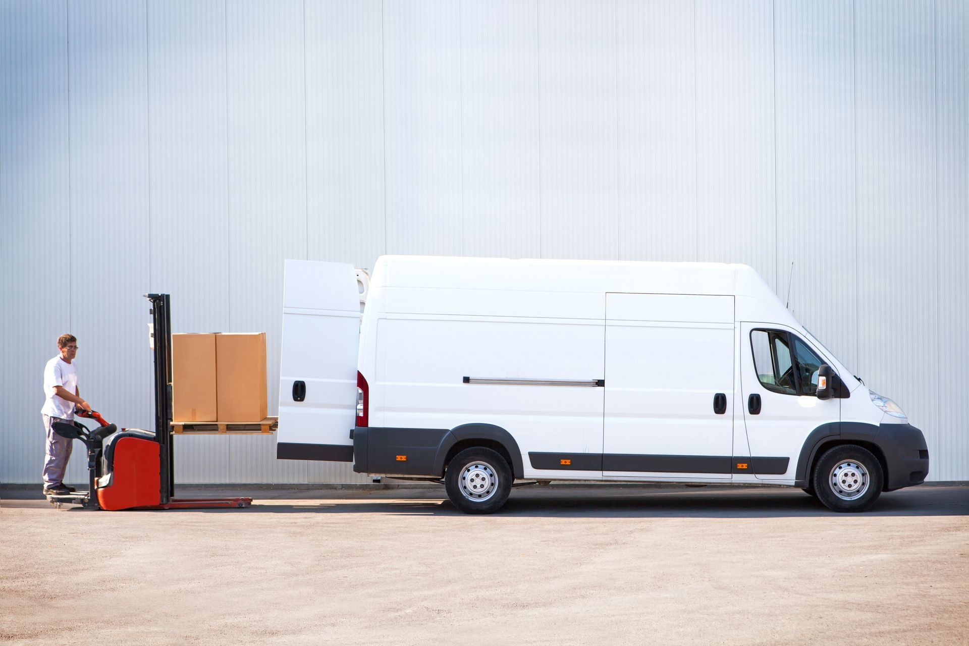 A man loading cargo in a delivery van