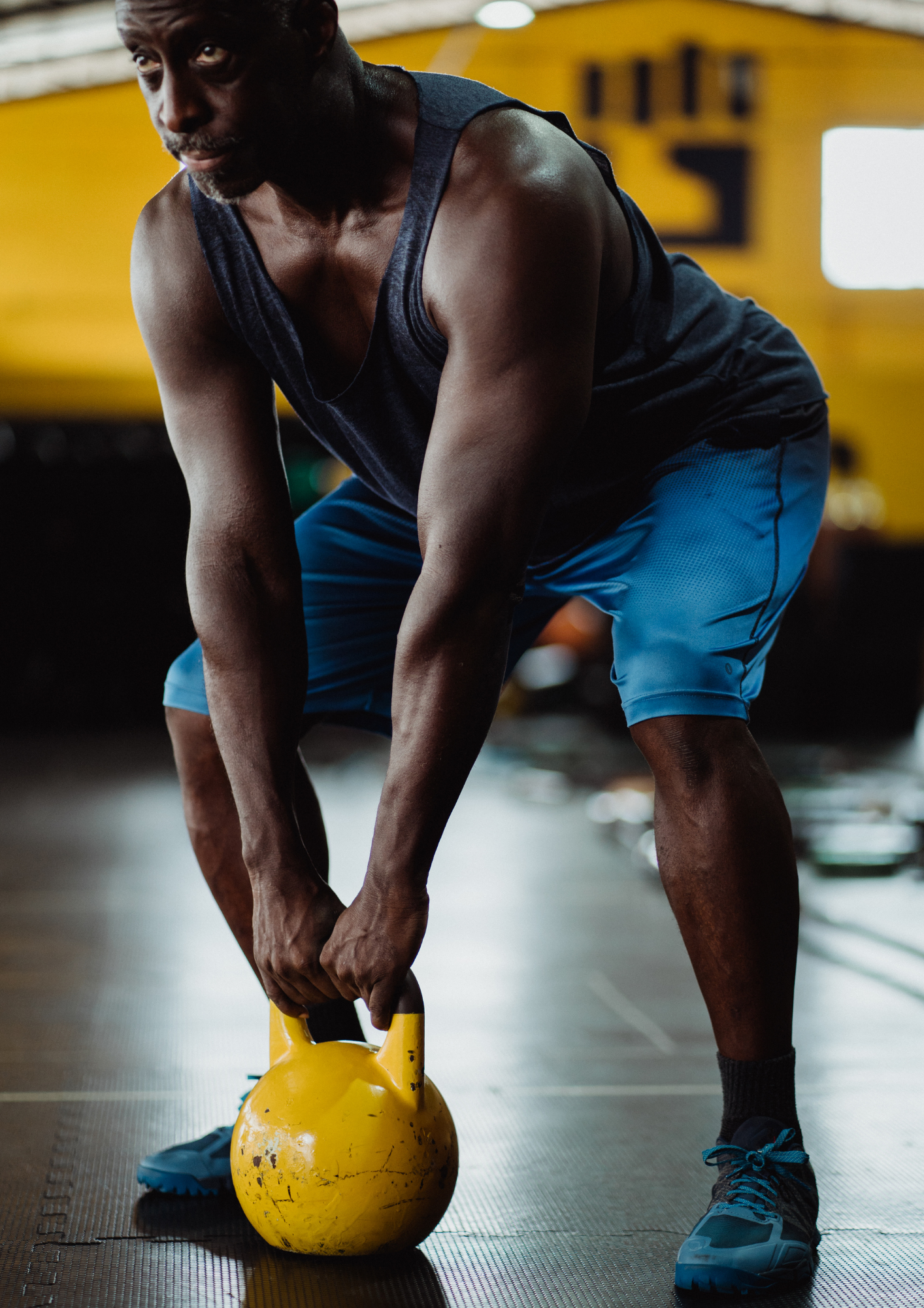 Patient performing a deadlift to manage hip and knee osteoporosis