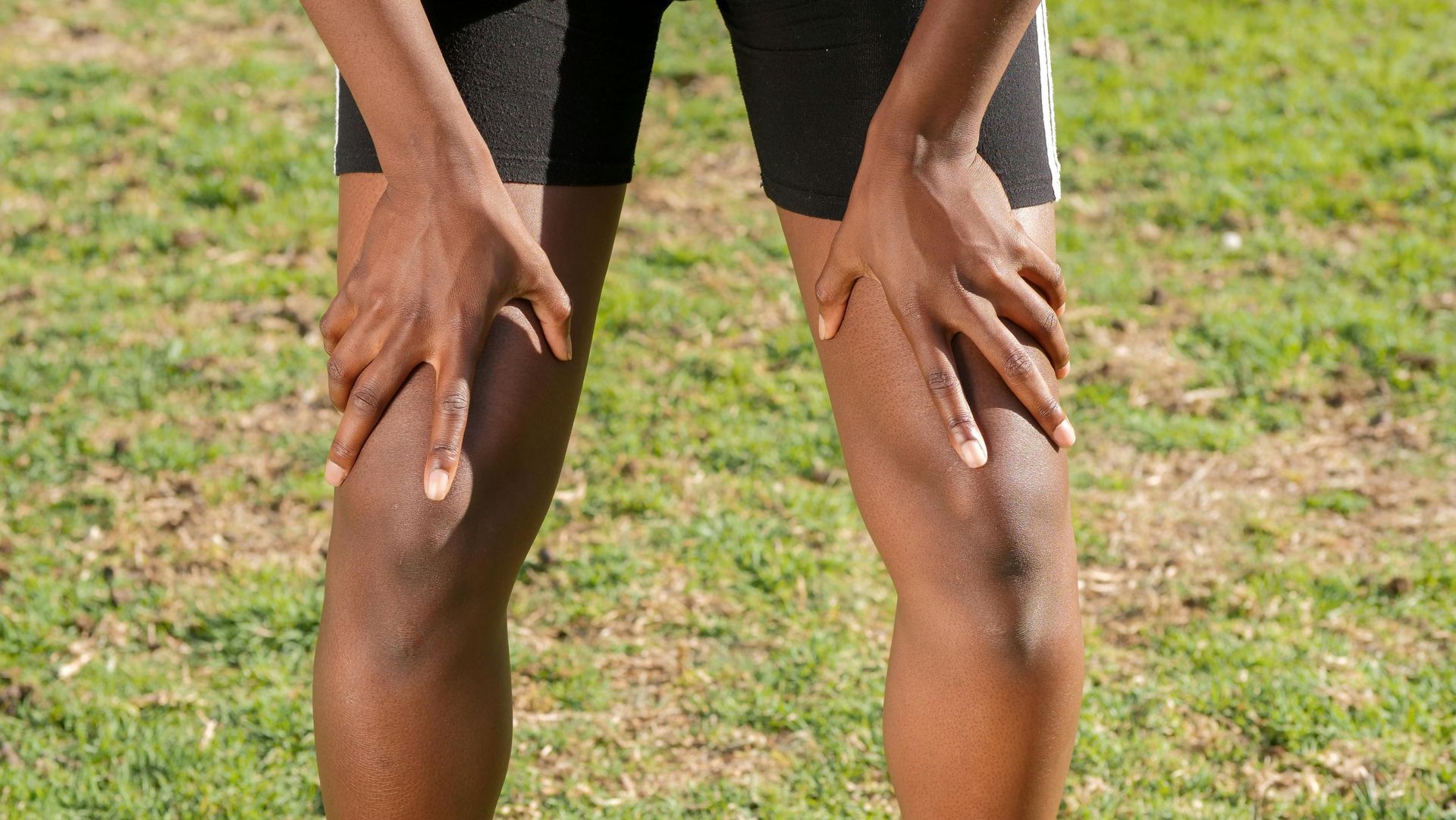 physiotherapist guiding patient through hip strengthening exercise for osteoarthritis