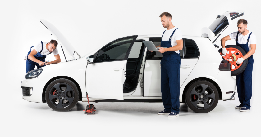 Mechanics working on a vehicle
