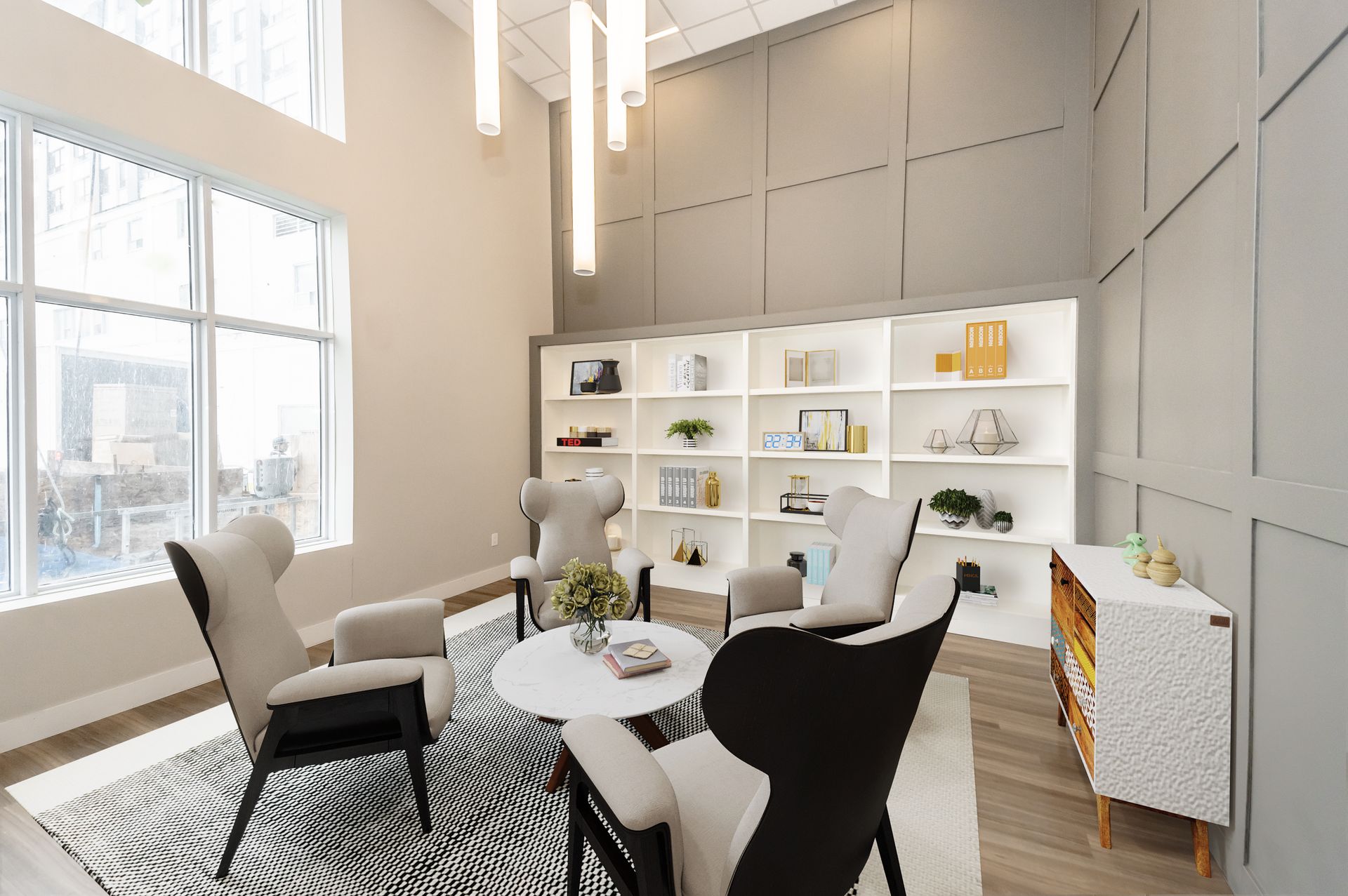 A living room with chairs , tables , and shelves.
