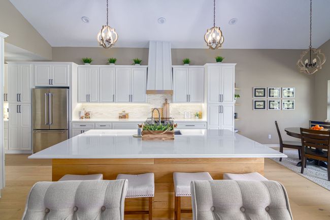 There is a large island in the middle of the kitchen.