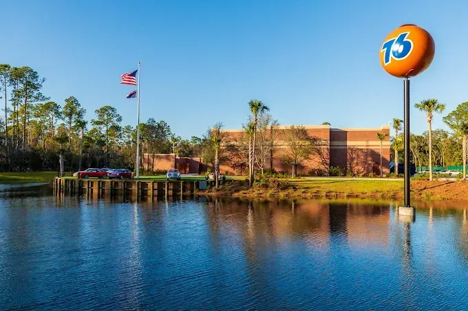 A building with a large orange sign that says 