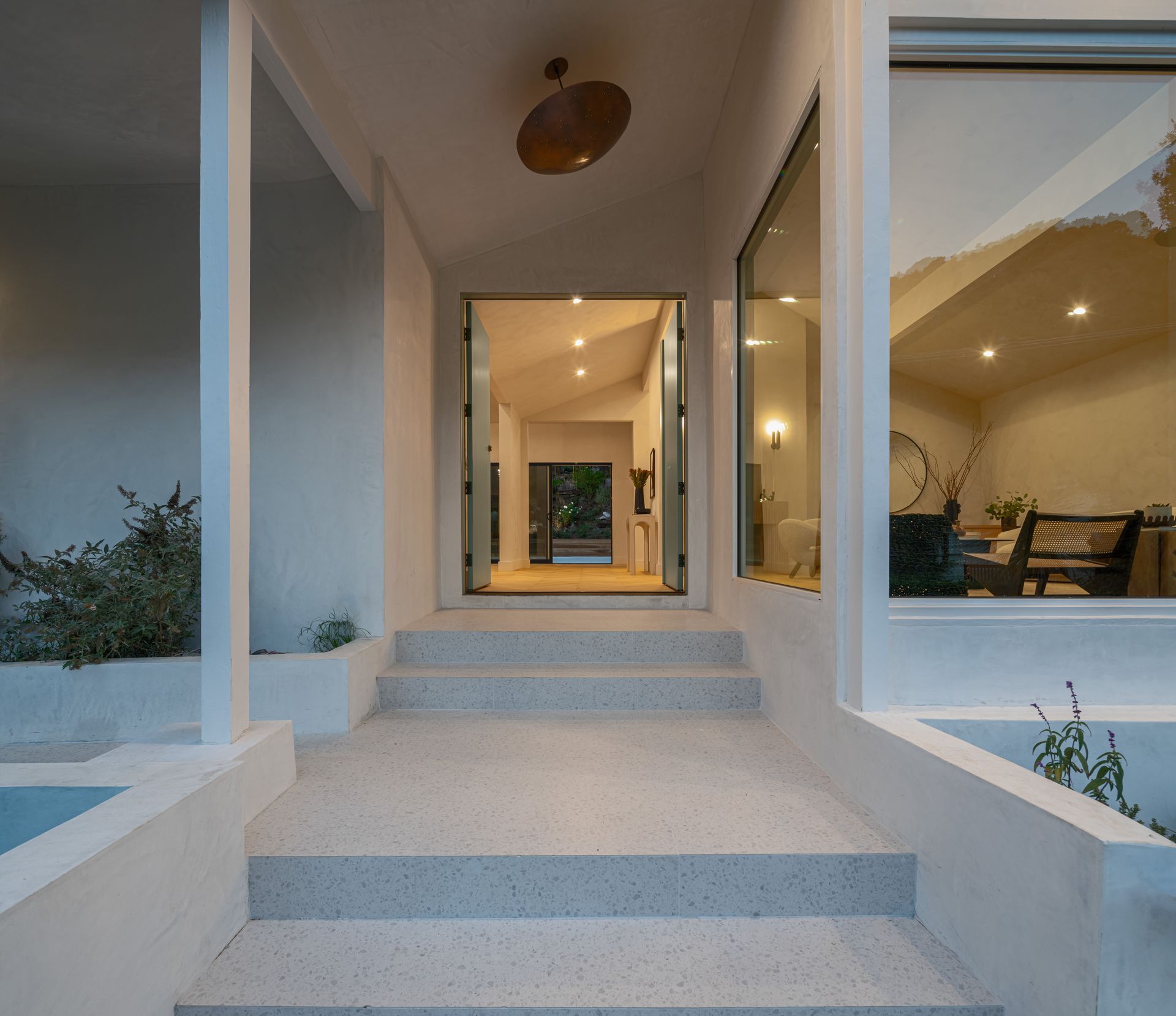 The entrance to a house with stairs leading up to it
