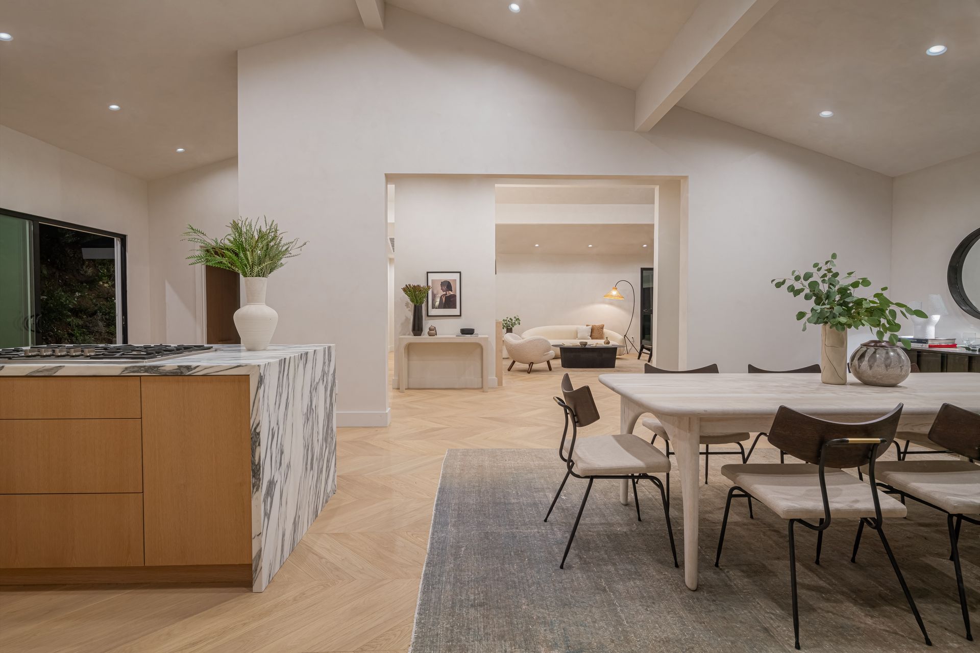 A kitchen with a table and chairs in it