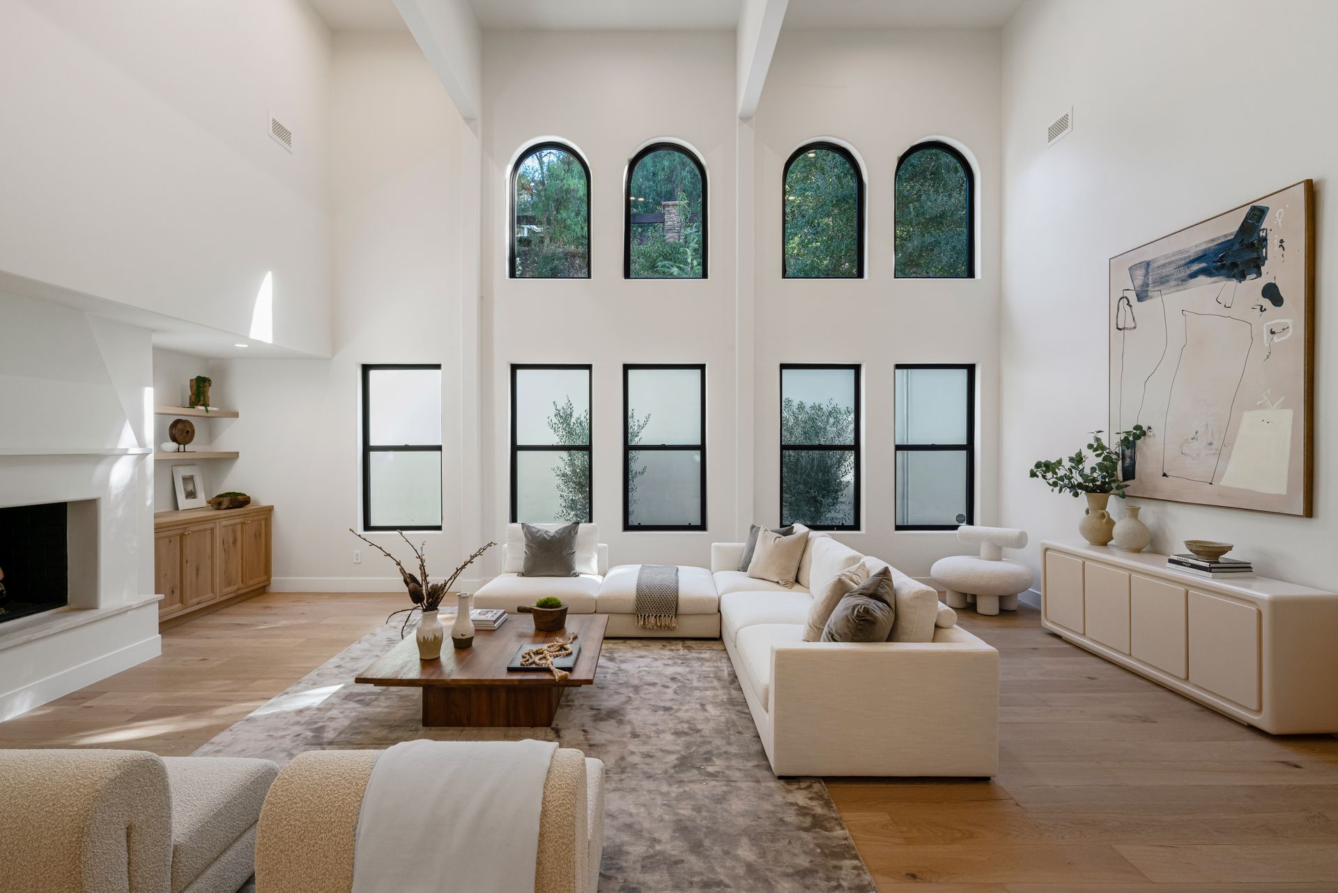 A living room filled with furniture and a fireplace.