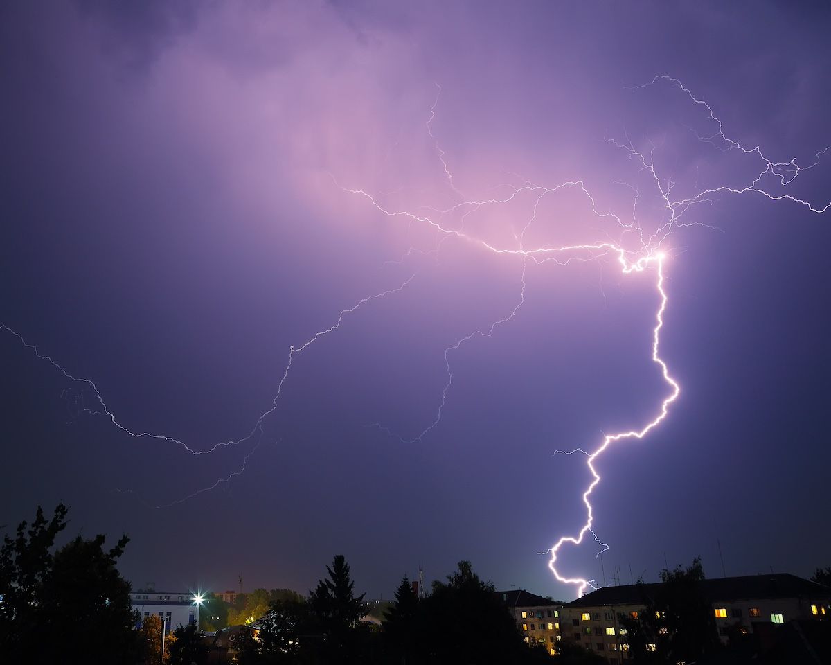 A Lightning Strike Over a City at Night. Protect Your Georgia Home From Power Outages With GenSpring