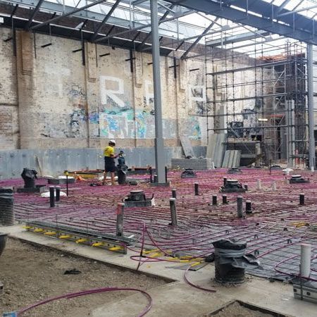 a building under construction with the word r on the wall