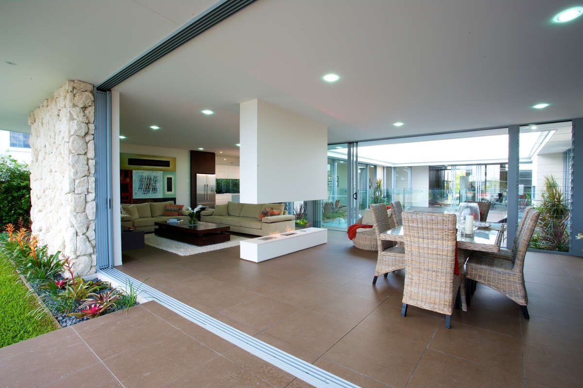 Stacker Doors and the Table and Chairs Inside the House | Port Pirie, Sa | Johnson Home Improvements