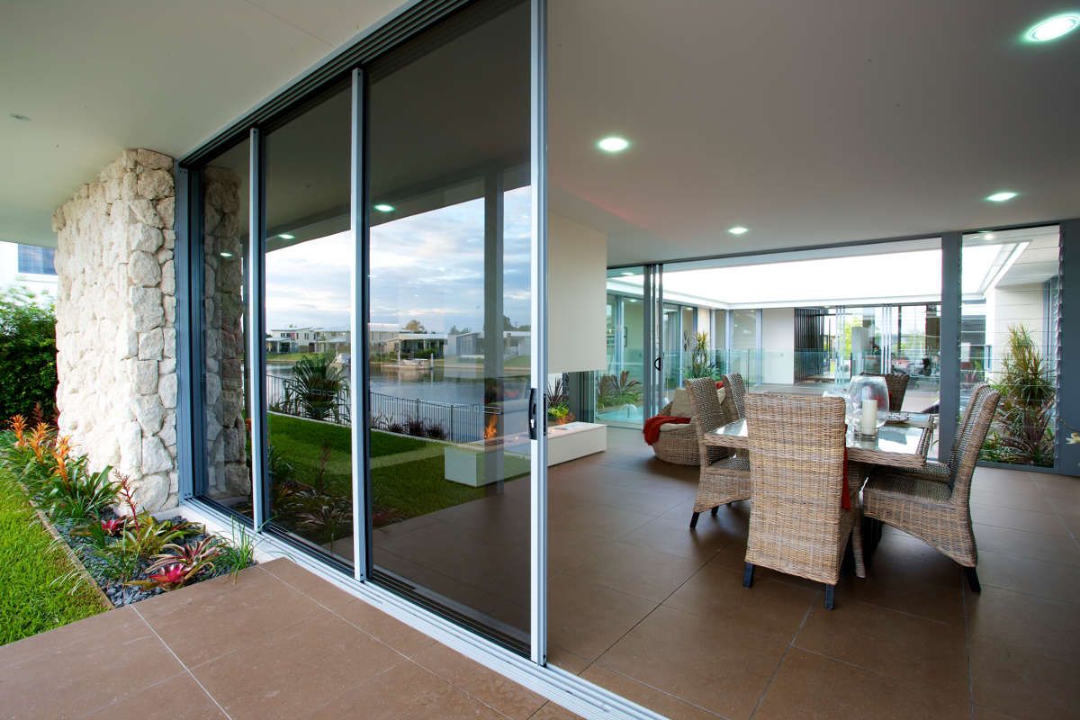 Stacker Door with a Dark Glass | Port Pirie, Sa | Johnson Home Improvements Stacker Door with a Dark Glass | Port Pirie, Sa | Johnson Home Improvements