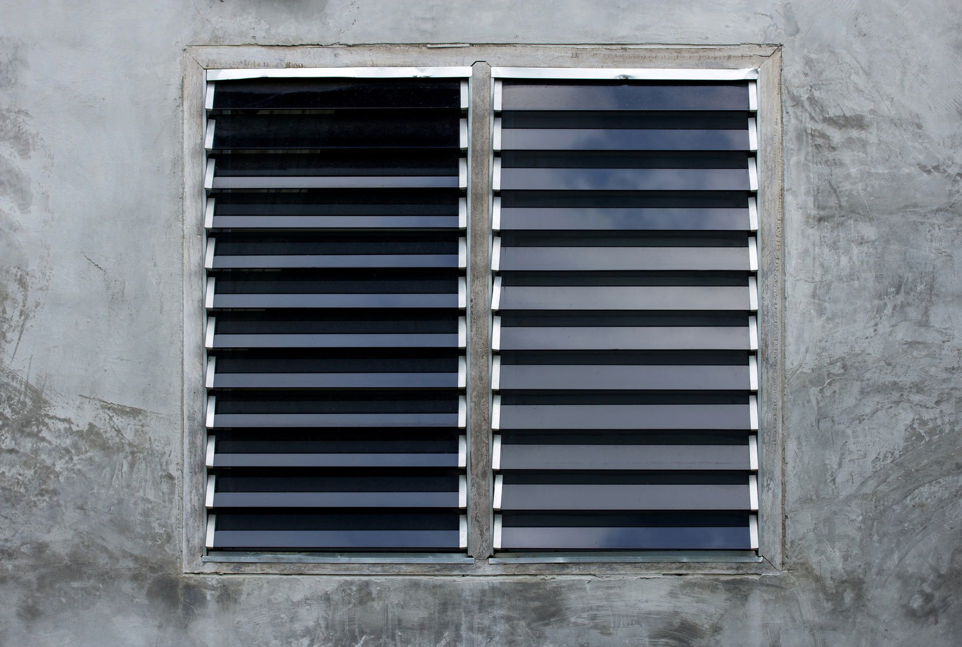 Louver Window on Gray Concrete Wall | Port Pirie, Sa | Johnson Home Improvements Louver Window on Gray Concrete Wall | Port Pirie, Sa | Johnson Home Improvements