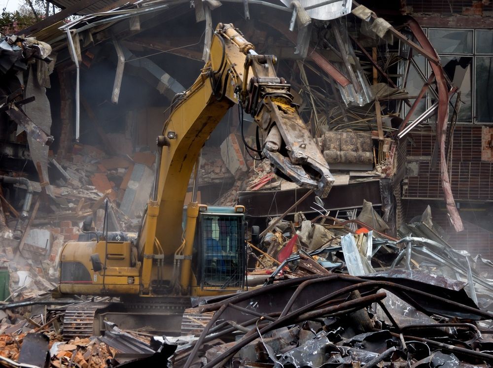 Demolition Of A Building With Excavator — Allcoast Group Demolition in Sunshine Coast, QLD